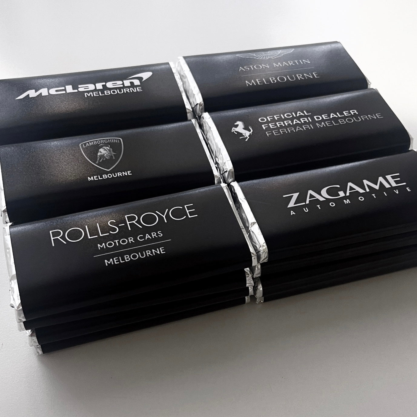 Custom Branded Chocolate Bars. Made In Melbourne By Lovr Designs. Luxury Car Brands such as Rolls Royce, McLaren and Zagame Automotive Created For Bez Media. Individually Wrapped Chocolate Bars. 40g German Chocolate. Birthday Chocolates. Event Favour Chocolates. Business Gift Chocolates.